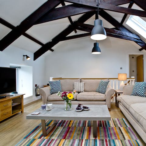 Chill out in the cosy living space underneath original timber beams