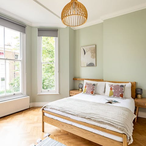 Wake up to leafy street views in the comfortable main bedroom