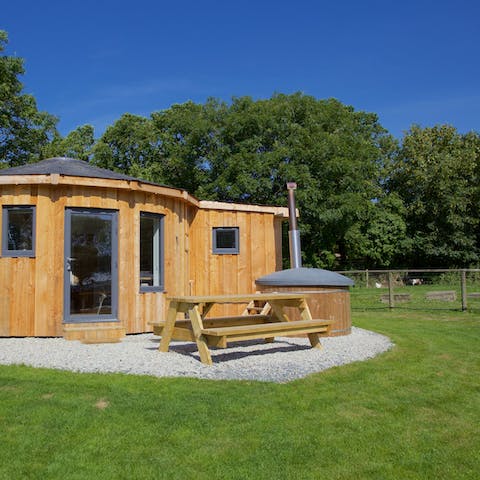 Take a seat and enjoy a romantic picnic lunch or indulge in an evening hot tub soak outside your glamorous roundhouse