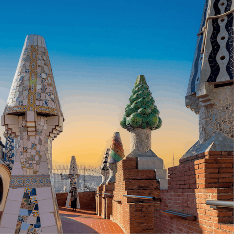 Visit the mosaic-covered sculptures at Park Güell, with exquisite views over the city 