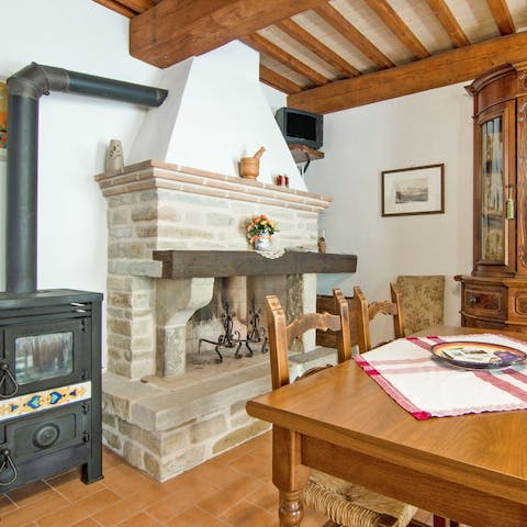 Indulge in an evening aperitivo by the stone fireplace