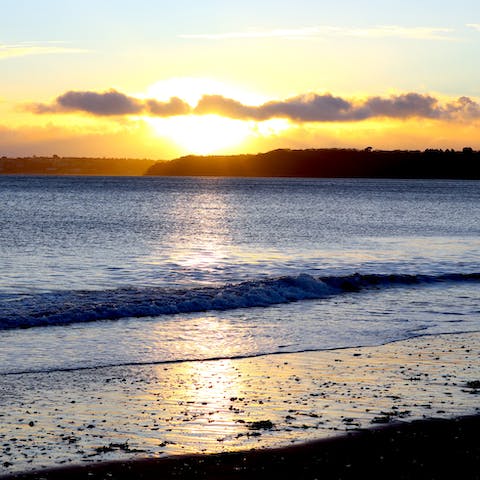 Wander down to Paignton Beach and watch the seaside sunset