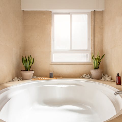 Treat yourself to an indulgent bubble bath in the jacuzzi