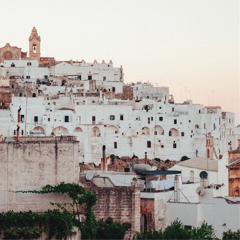 Drive to the whitewashed town of Ostuni and spend the day admiring it