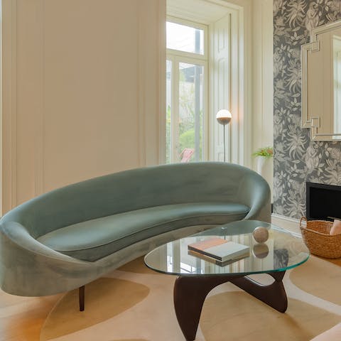 Relax in stylish surrounds with a curvy sofa and mid-century touches