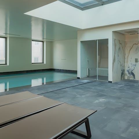 Pad down to the shared indoor pool for a swim and a sauna session