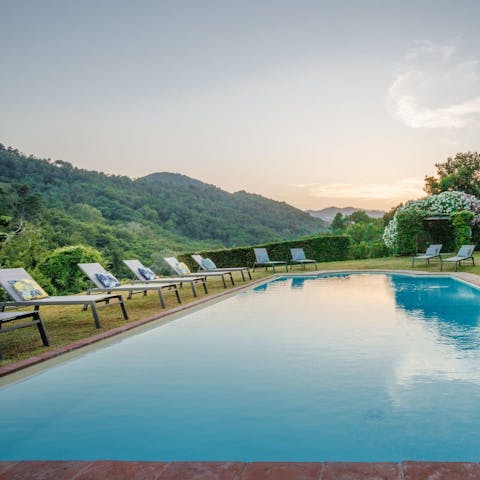 Admire views of the Tuscan hills while cooling off in the pool