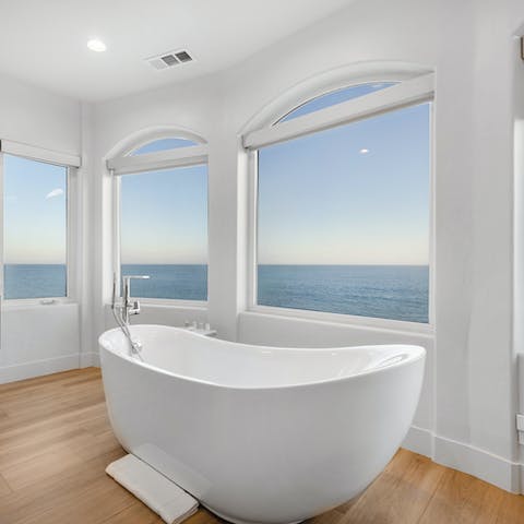 Watch the sunset as you soak in the freestanding tub