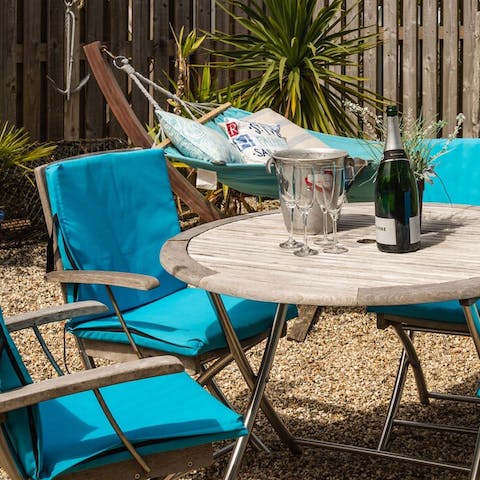 Dine and gossip alfresco in the sunny courtyard