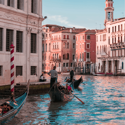 Treat yourself to a gondola ride on Venice's famous canals