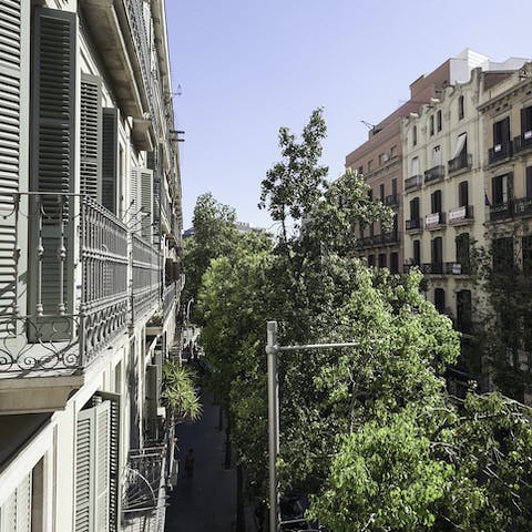 Take in the views over the neighbourhood from the ornate balcony