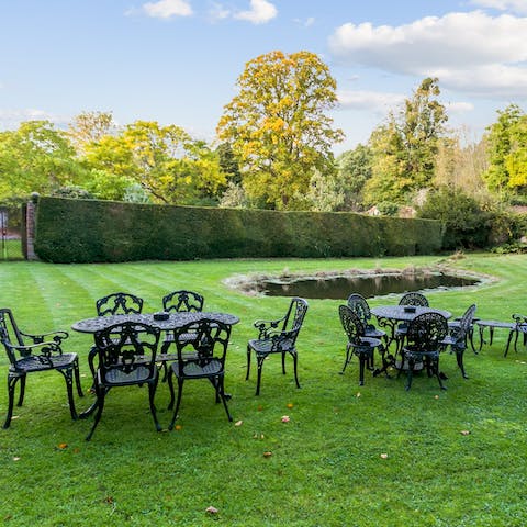 Drink or dine alfresco in the picturesque walled garden complete with natural pond