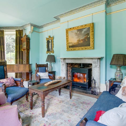 Gather around the big wood-burning stove in the grand lounge