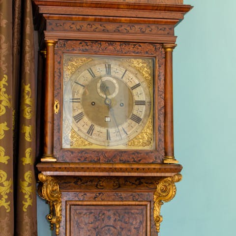 Admire the antiques and oil paintings that fill this home