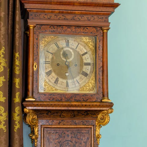 Admire the antiques and oil paintings that fill this home