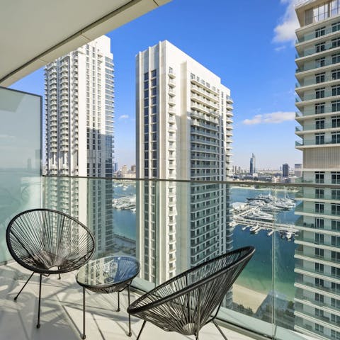 Take a seat on the apartment's balcony and gaze out over skyscrapers and sea