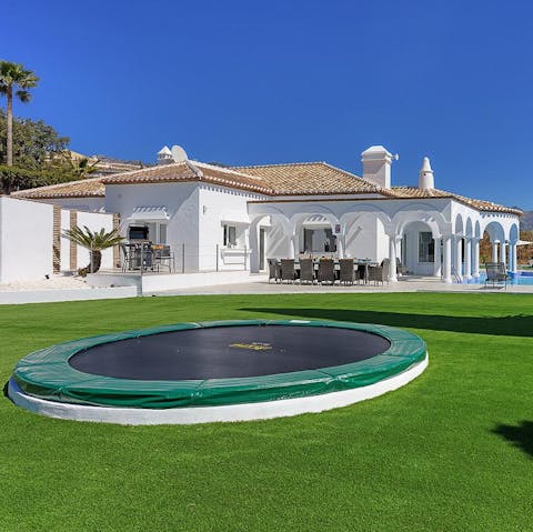 Relax by the pool while the kids entertain themselves on the trampoline or playing on the well manicured grass