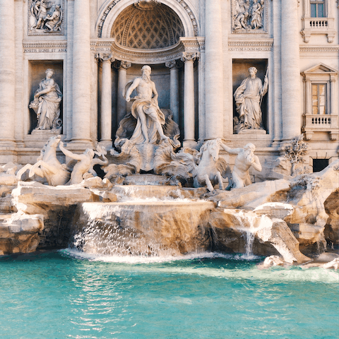 Admire the beautiful Trevi Fountain, just under a half an hour walk or a fifteen-minute ride away 