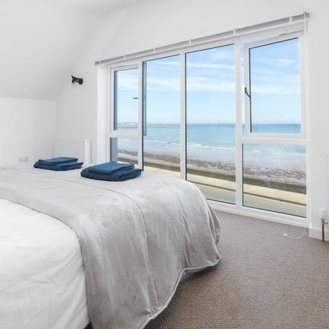 Take in stunning water front views from the comfort of bed