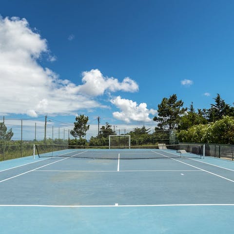 Practise your swing at the tennis court, before an afternoon spent lazing on Cascais Beach