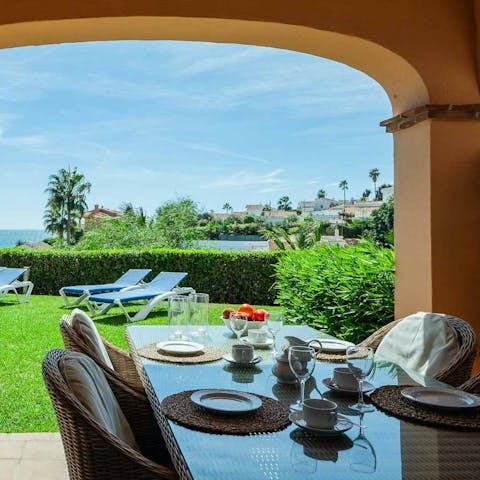 Tuck into breakfast while admiring the sea view