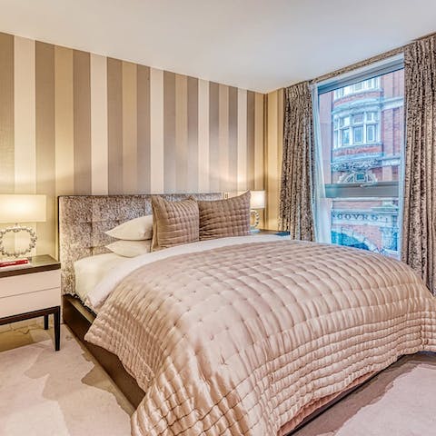 Enjoy a luxurious night's sleep in the boudoir-style bedroom
