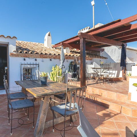 Fire up the barbecue and enjoy Spanish feasts on your rooftop terrace