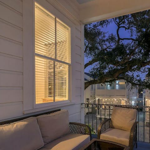 Enjoy an Old Fashioned at sundown on your balcony