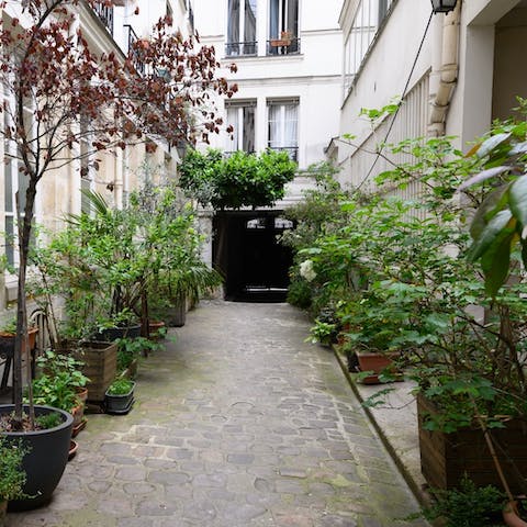 Enter your charming apartment through the quiet communal courtyard