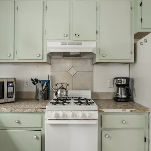 Whip up something tasty in the quaint mint-coloured kitchen
