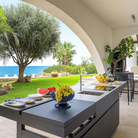 Whip up snacks and drinks to enjoy by the pool at the outdoor kitchen