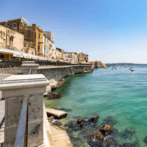 Stay on the coast of Sicily, a twenty-five minute drive from Syracuse