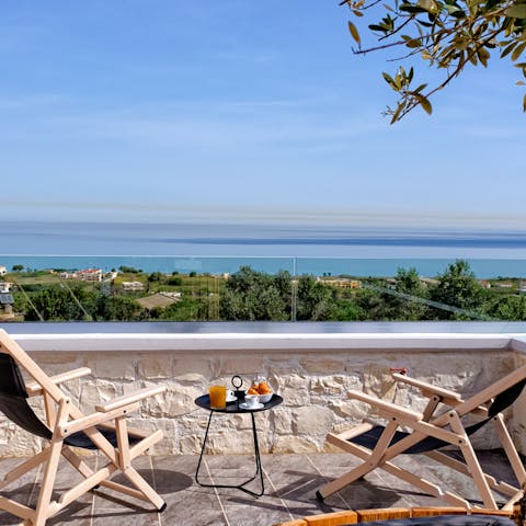 Sit back on the balcony and gaze out toward Chania Bay