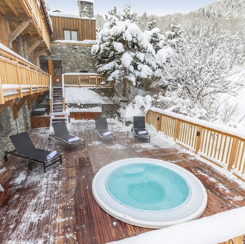 Warm up in the outdoor hot tub and admire the mountain views