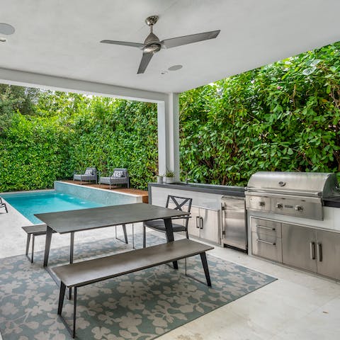 Dine alfresco in the outdoor kitchen, complete with a barbecue grill and ice maker