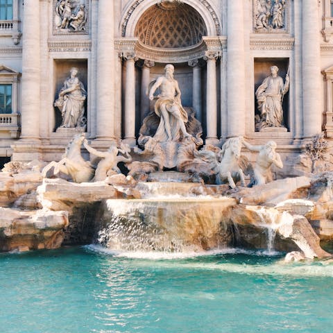 Walk just one minute to the iconic Trevi Fountain and toss in your three coins