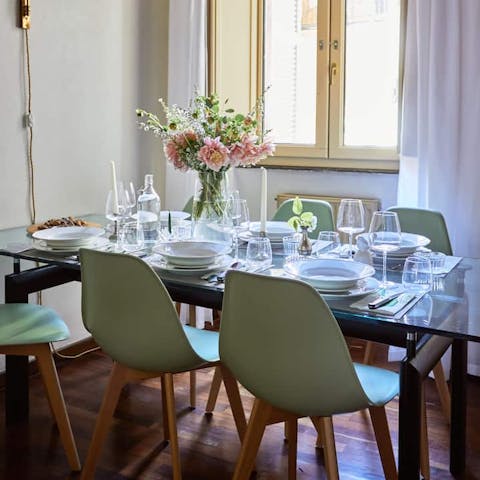 Gather the group at the dining table in the sunny window spot