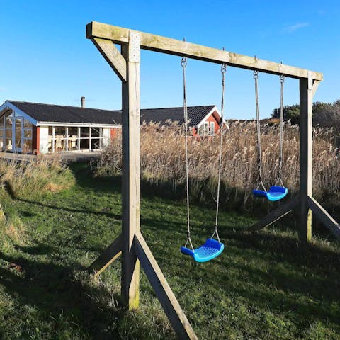 Let the kids play on the swings while you prep the barbecue for lunch
