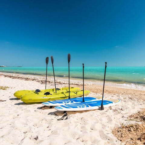 Go kayaking or paddleboarding in the turquoise shores of the Pacific Ocean