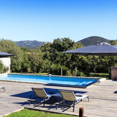 Sunbathe on the pool deck before playing boules on a private pitch