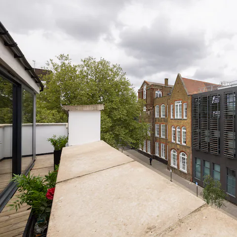 Head out onto the apartment's rooftop terrace and feel the sun on your skin