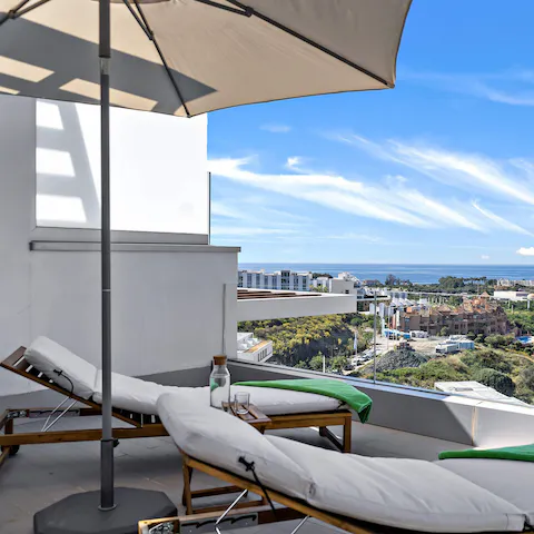 Catch some rays over your holiday read from the upper deck's sun loungers