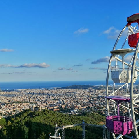 Head up to Tibidabo in an hour on public transport and marvel at the views