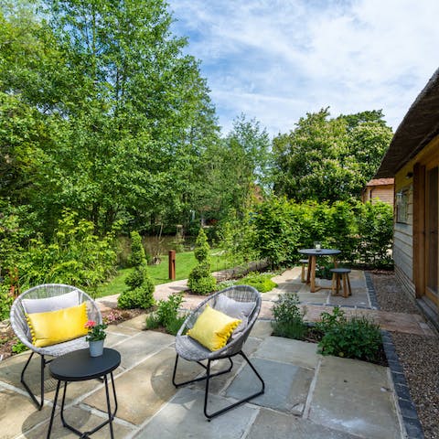 Sit out in the screened courtyard garden