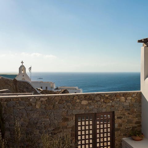 Admire the traditional church's belltower against the endless blue