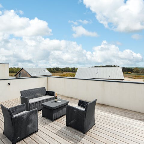 Toast the day's end from the private rooftop terrace with countryside vistas