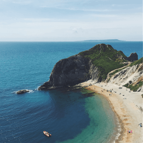 Pack up a beach bag for a day along the Jurassic Coast, just a short drive away