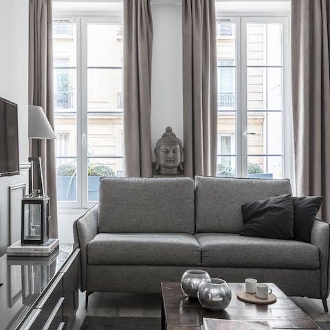 Gaze out of the big French windows at the typically Parisian boulevard