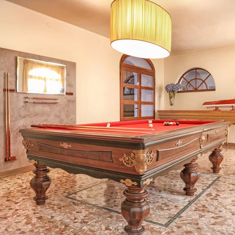 Hang out in the billiards room of a 1920s home designed by Giancarlo Maroni