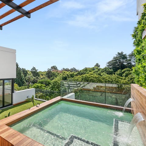 Enjoy a dip in the shared pool while you take in the leafy views around you
